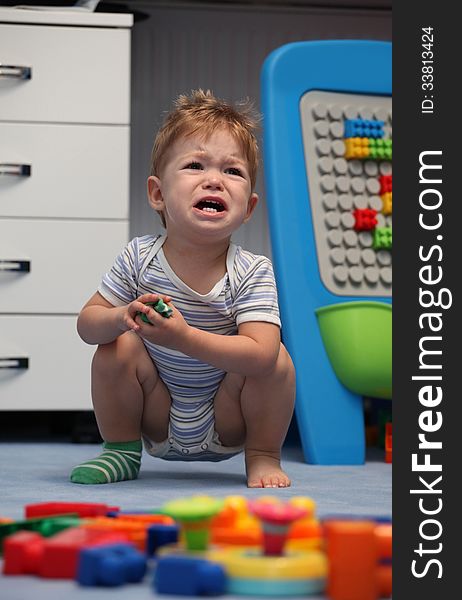 A Baby Boy Crying In Children Room