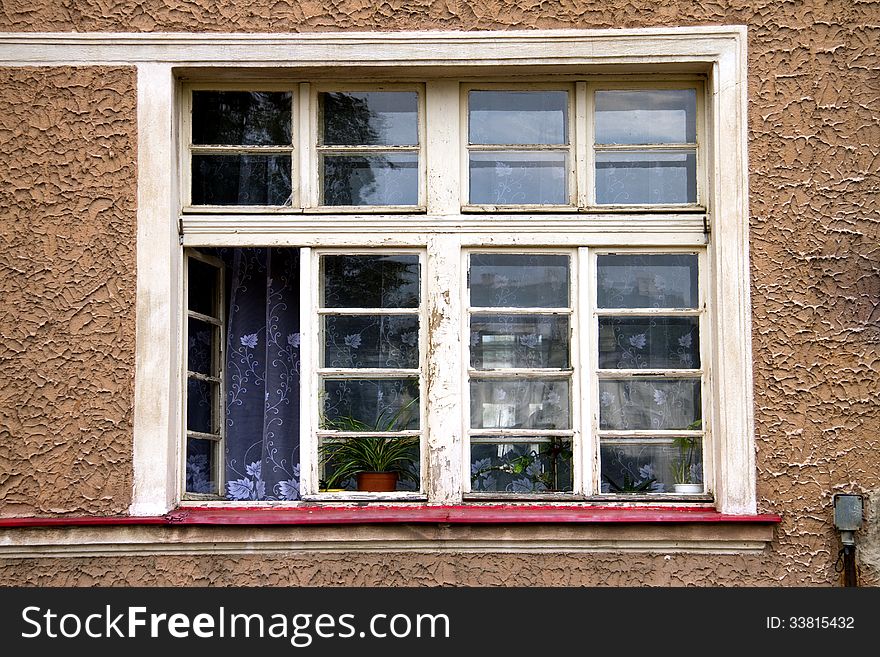 Old wooden window with one openend lattice. Old wooden window with one openend lattice