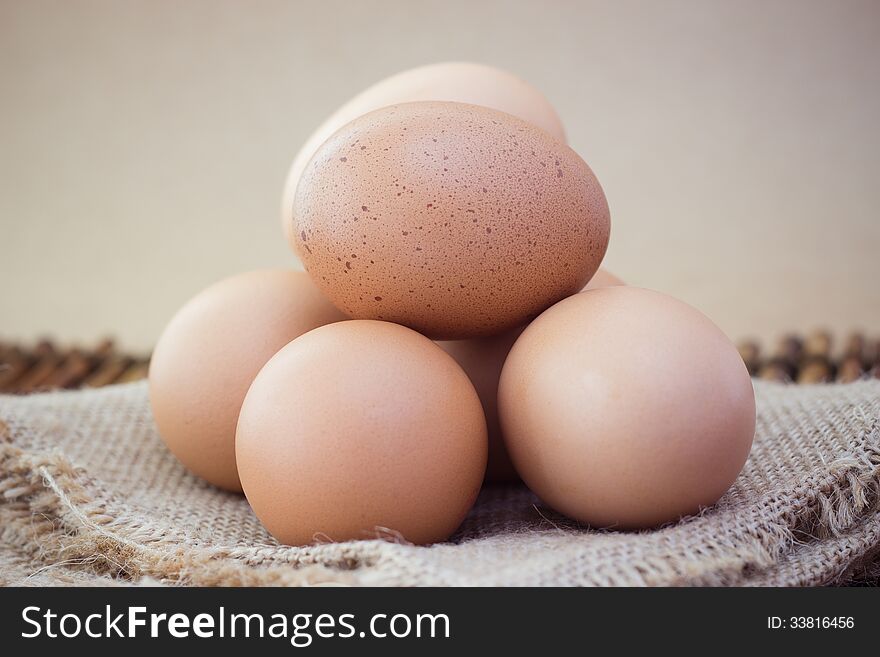 Five eggs isolated on Brown background