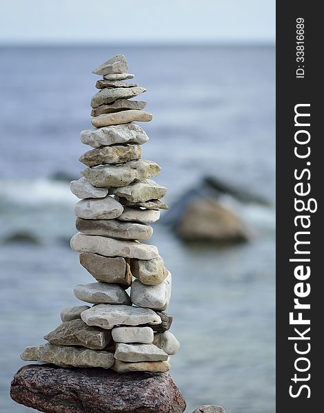 Pile of stones on the sea background. Pile of stones on the sea background