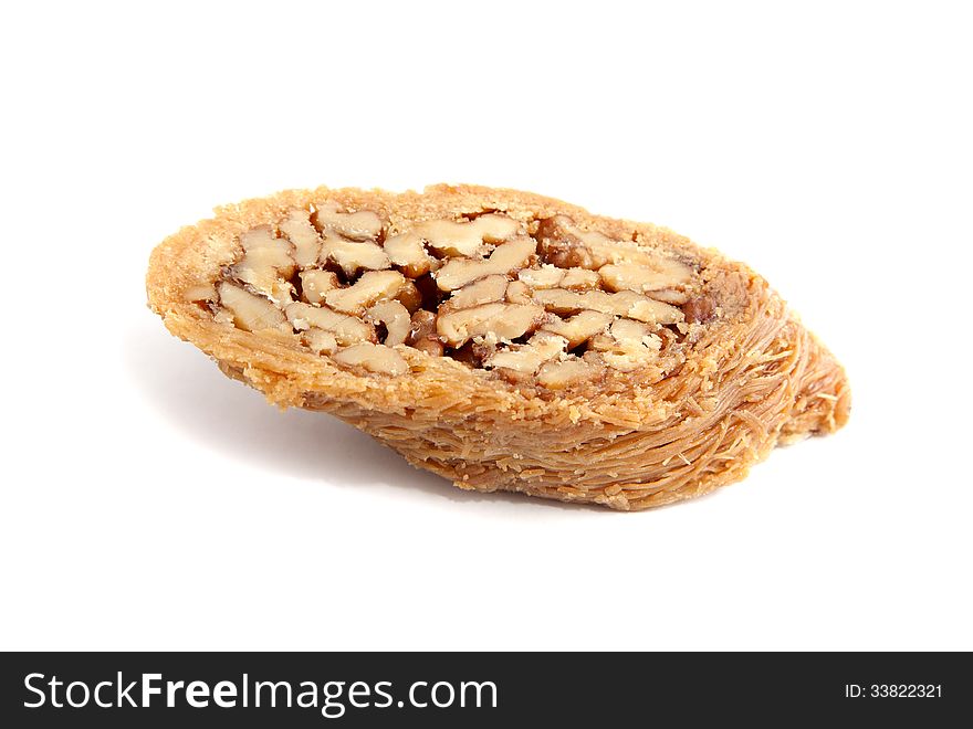 Piece of turkish baklava over white background