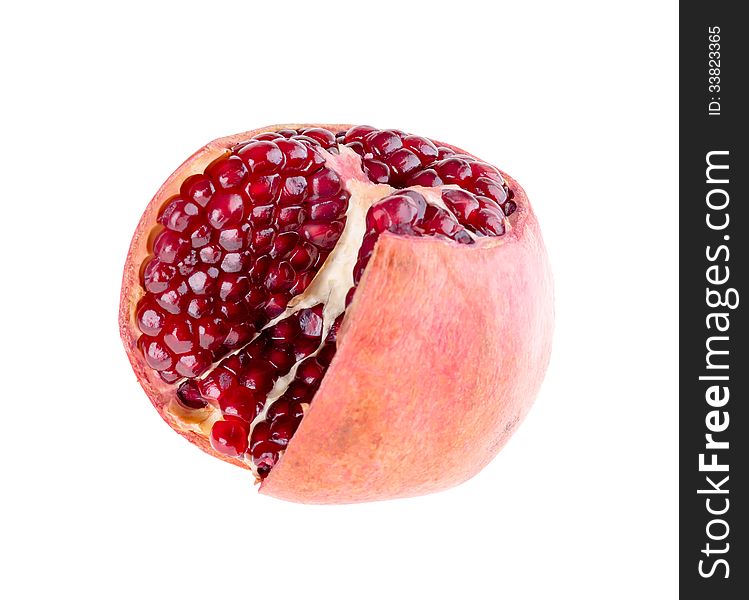 Cut the pomegranate fruit on the white