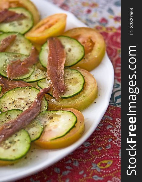 Tomatoes cucumber and anchovies fresh salad. Tomatoes cucumber and anchovies fresh salad