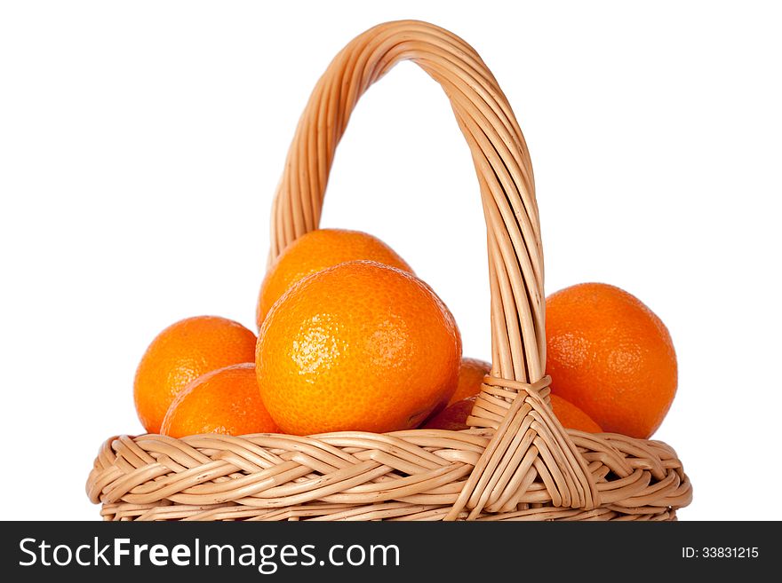 Basket of fresh oranges, mandarines or tangerines on white background. Basket of fresh oranges, mandarines or tangerines on white background