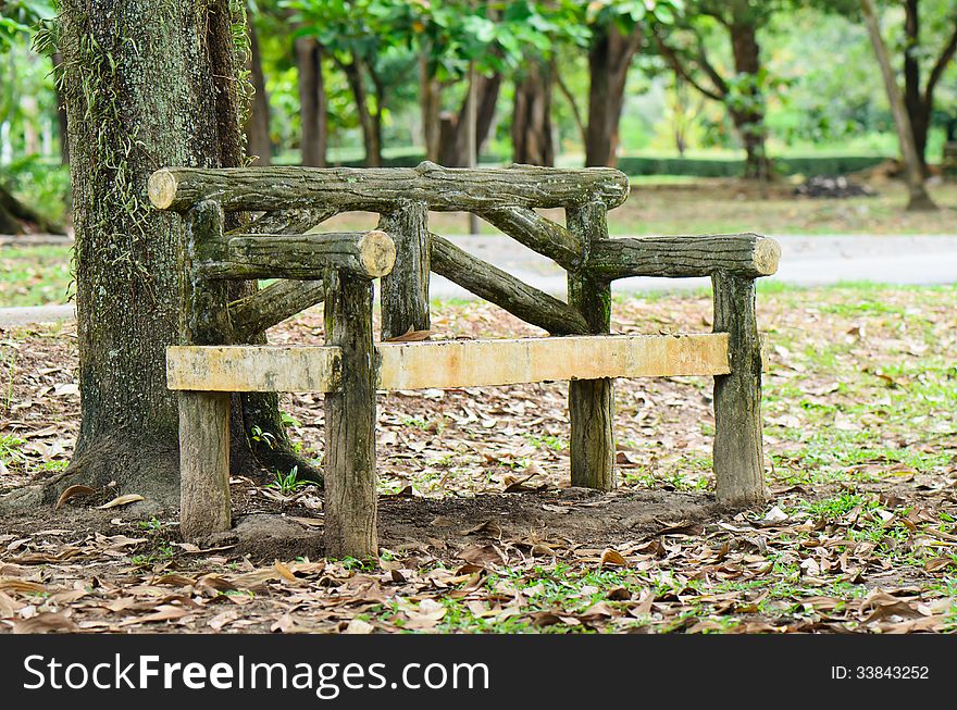 Bench alone setting in a park. Bench alone setting in a park