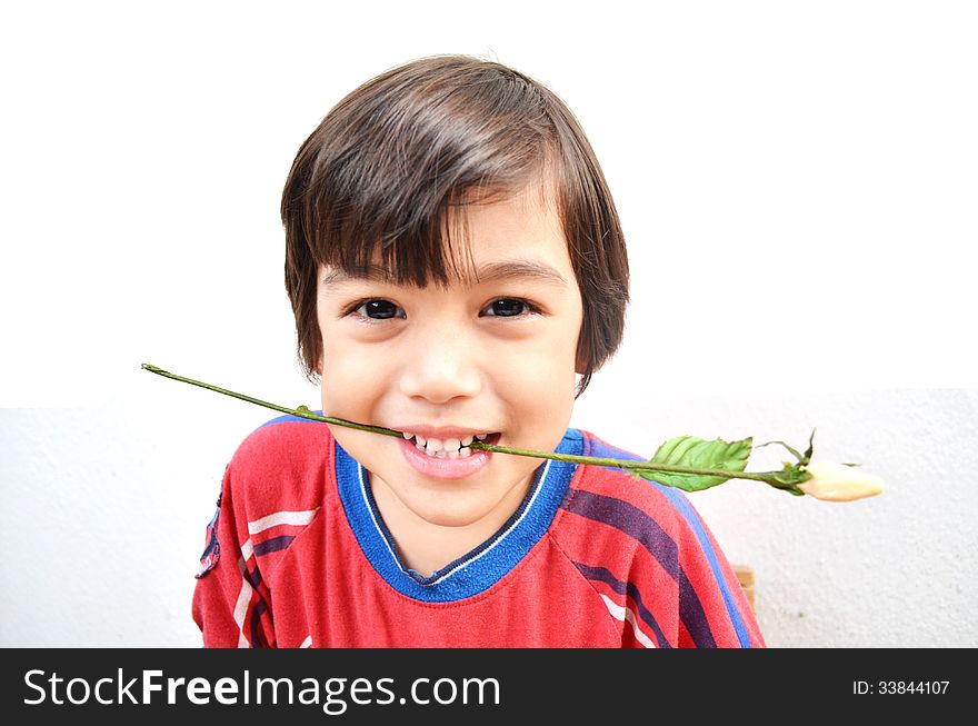 Little Boy Smiling With Flower