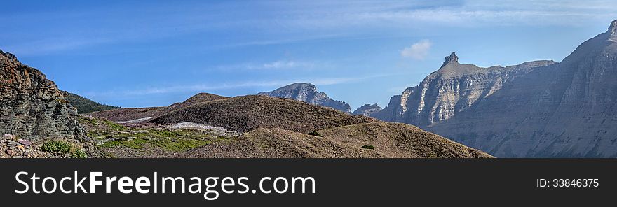 This panorama image captures glacial moraines and a portion of Glacier National Park's famous Garden Wall. This panorama image captures glacial moraines and a portion of Glacier National Park's famous Garden Wall.