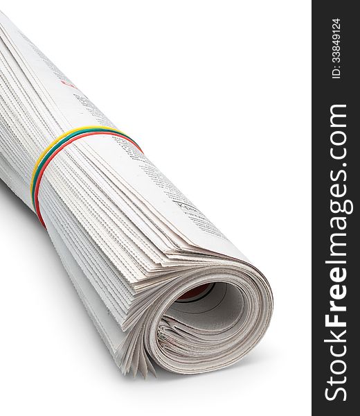 The roll of the newspapers which have been pulled together with an elastic band on a white background. The roll of the newspapers which have been pulled together with an elastic band on a white background