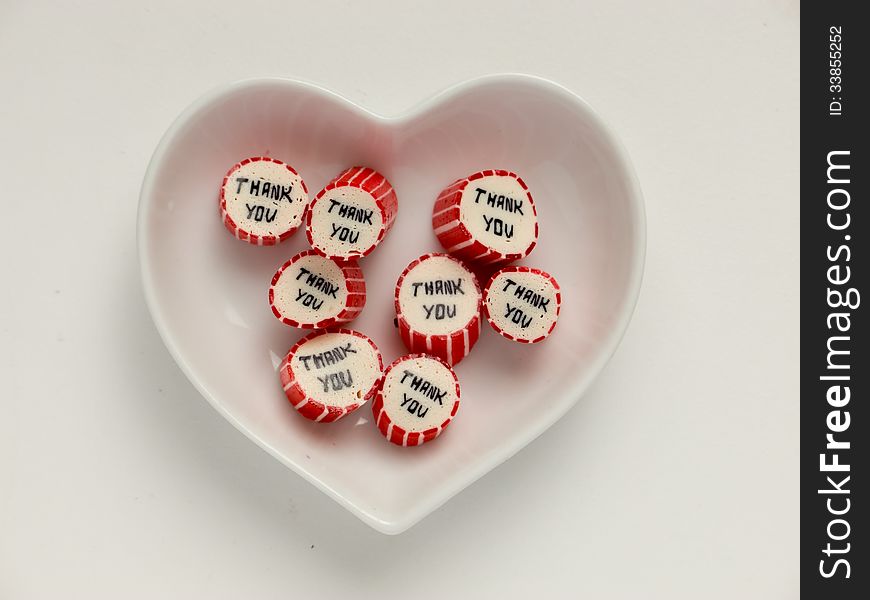 Heart-shaped plate with thank you candies