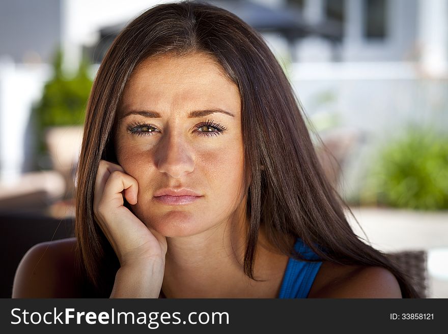 Portrait of a pretty sad young woman At Home