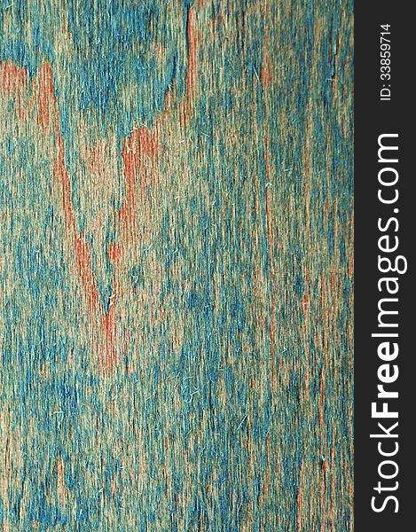 Vertical wooden background with blue and orange scratches. Vertical wooden background with blue and orange scratches