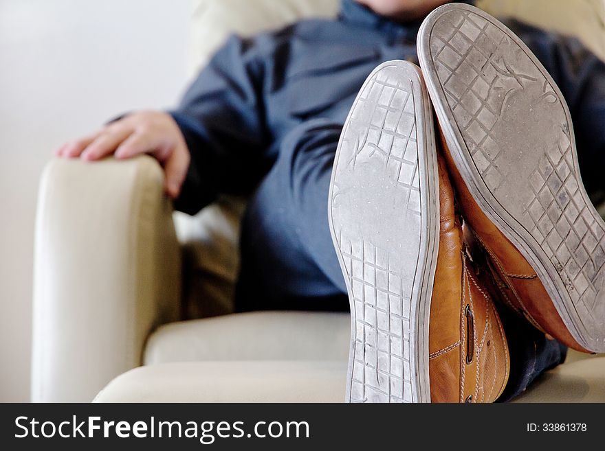 Image of man lounging on chair