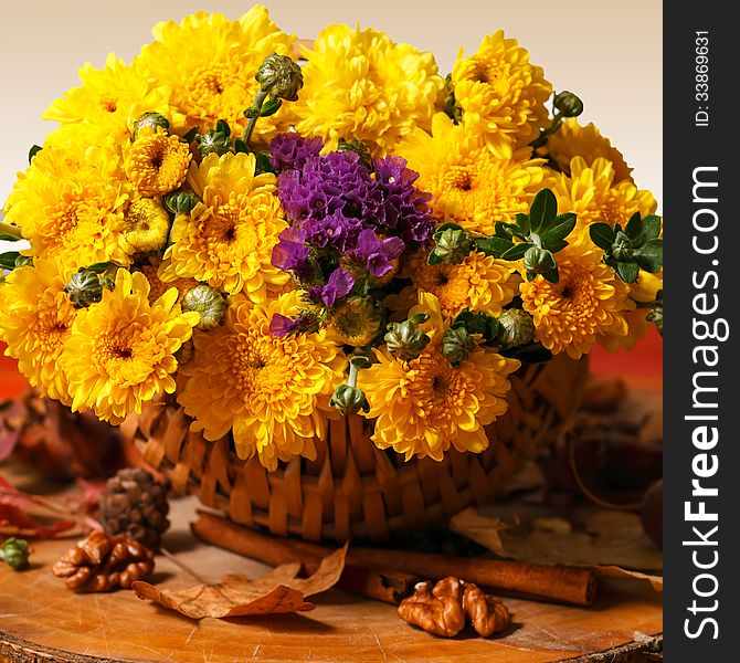 Still life with colorful autumn flowers in rustic decor