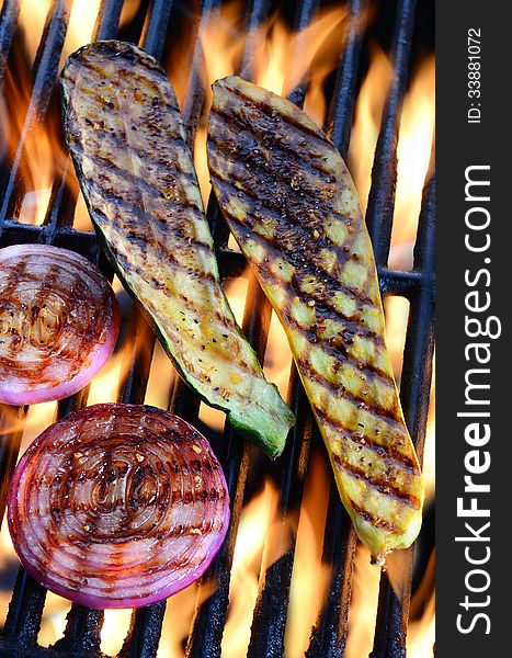 Vegetables on a barbecue grill over an open flame. Vegetables on a barbecue grill over an open flame