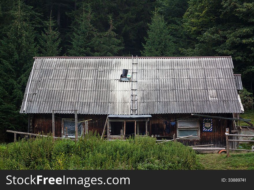 Old house in the woods. It has long been abandoned structure. Old house in the woods. It has long been abandoned structure.