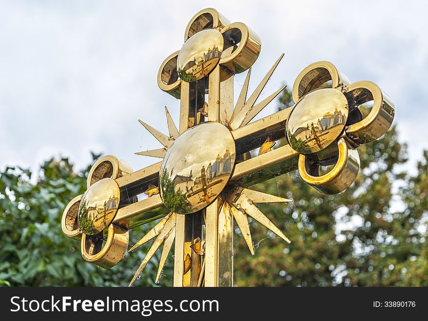 Golden orthodox cross details close up