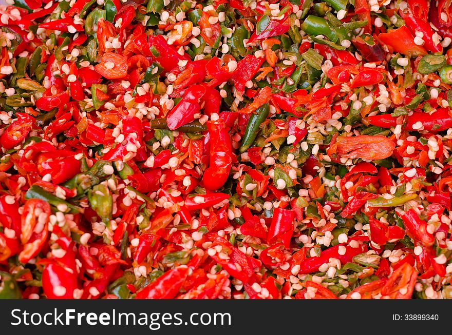 Crushed red and green chili background. Crushed red and green chili background