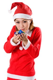 Cute Santa Blowing Tiny Gifts Stock Image