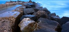 Rocks And Blue Sea At Sunset Royalty Free Stock Photo