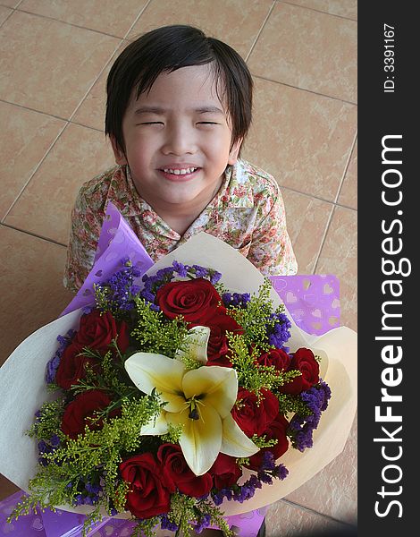 Boy holding rose bouquet