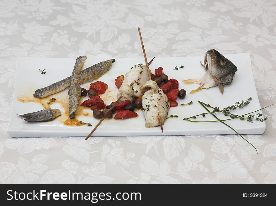 Skewer fish,, branzino italian cooked