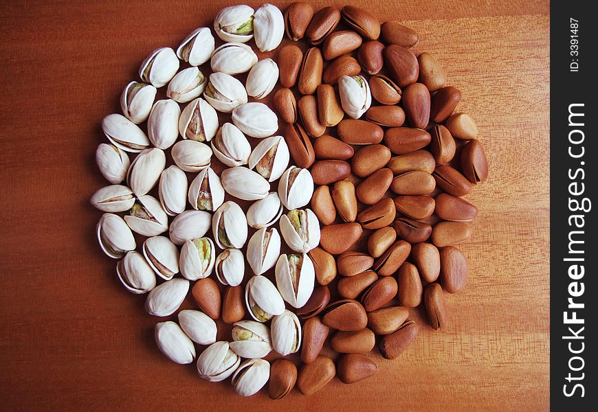 Pistachio and pine nuts; the shape of Black & White Fish