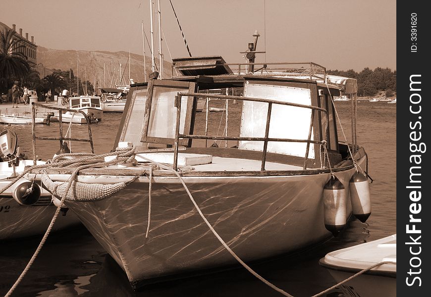 Old boat at the harbour of a little island