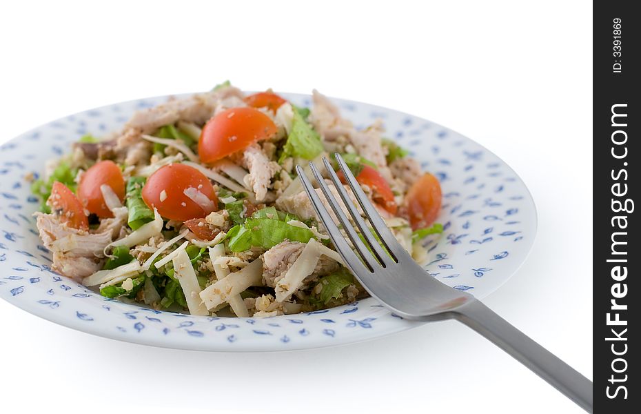 Salad in plate with fork, isolated white. Salad in plate with fork, isolated white