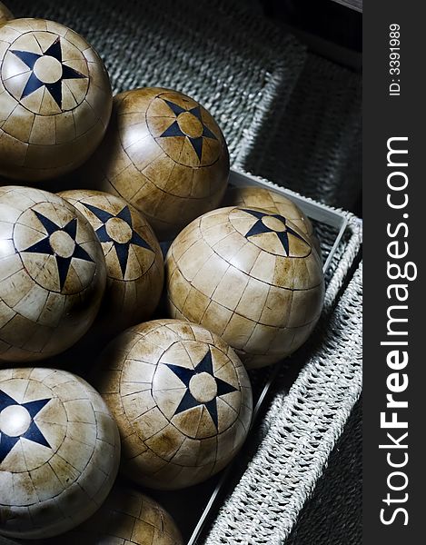 Decorative woos balls with five pointed stars in a basket. Decorative woos balls with five pointed stars in a basket