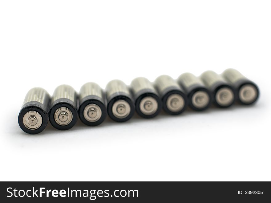 Several batteries, isolated white background
