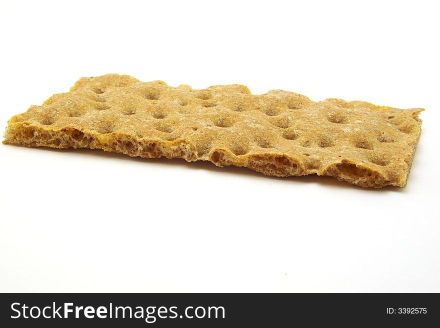 Crispybread from Rye flour, it is very porous. Isolated on a white background. Crispybread from Rye flour, it is very porous. Isolated on a white background.