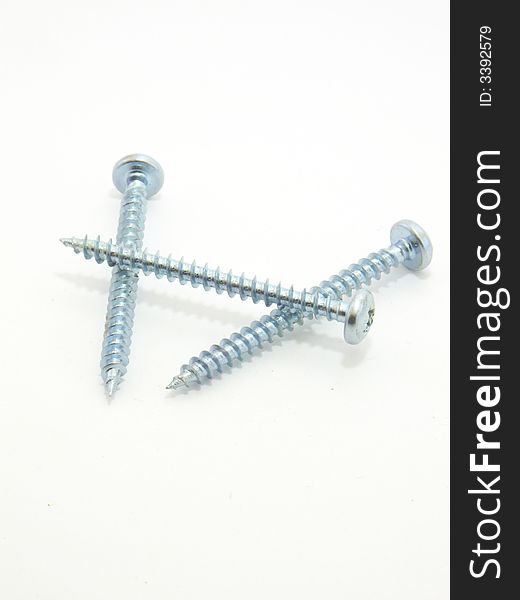 Three screws. One is screw top. Isolated on a white background.