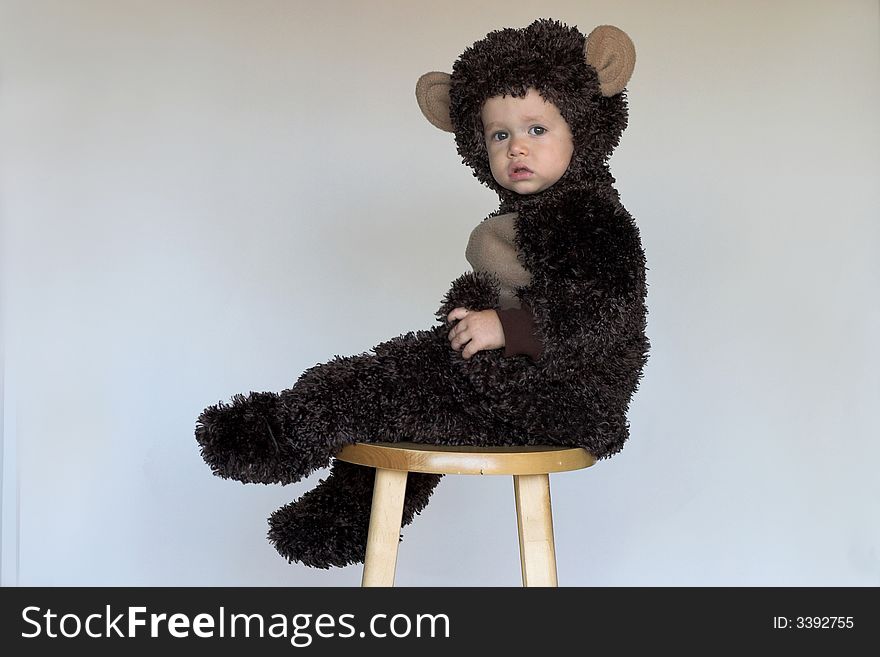 Image of cute toddler wearing a monkey costume. Image of cute toddler wearing a monkey costume