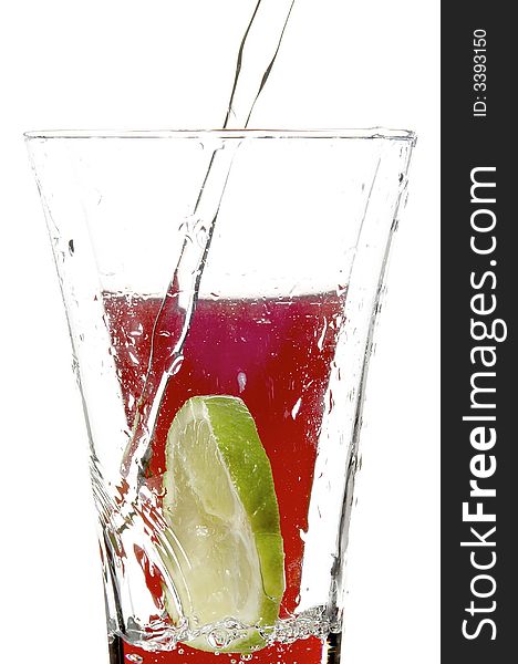 Glass with juice and lime on the white background