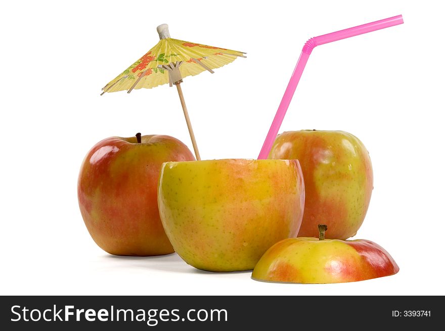 Apples with umbrella and straw on white background