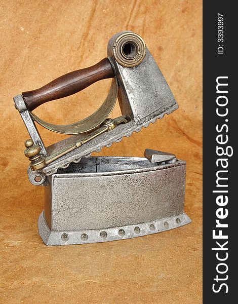 Open old iron with brown background