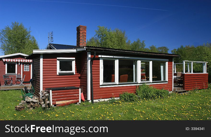 A red summer house in need of some fixing up