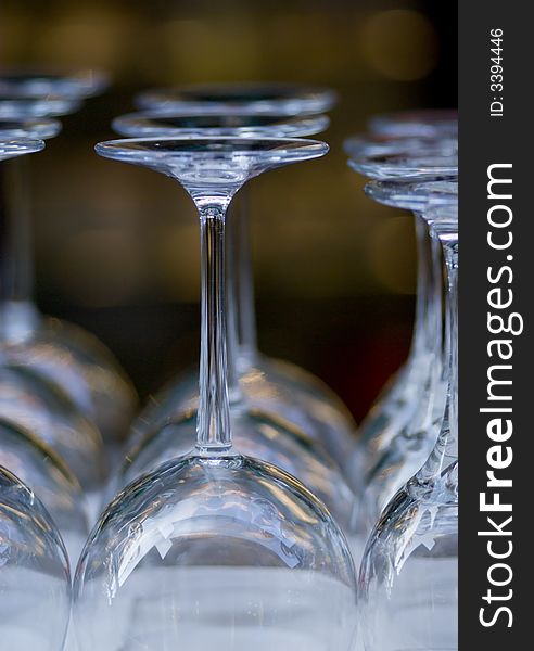 Empty Wine glasses in a row. Shallow depth of field. FOcus on the first row