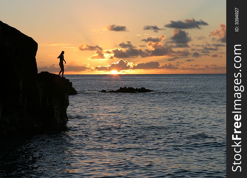 Sunset at Jump Rock in Wainea Bay beach, Hawaii