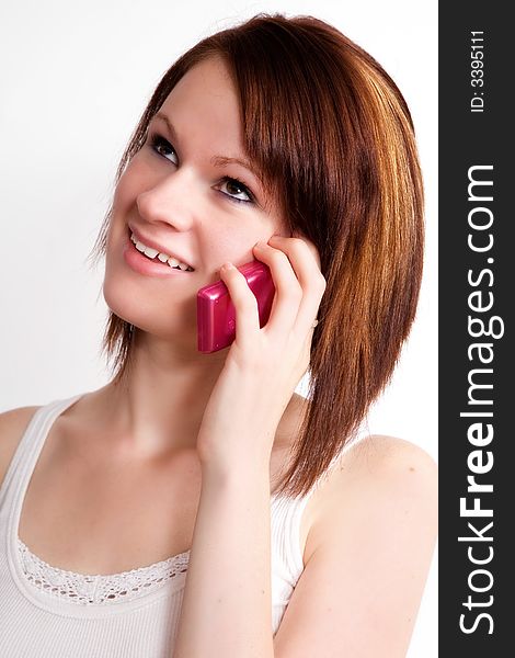 Close up of a teen girl talking on the phone. Close up of a teen girl talking on the phone.