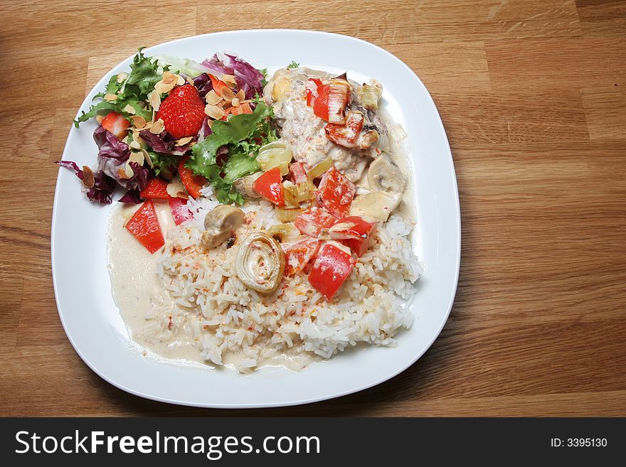 Plate of ready to eat chicken with rice and salad. Plate of ready to eat chicken with rice and salad