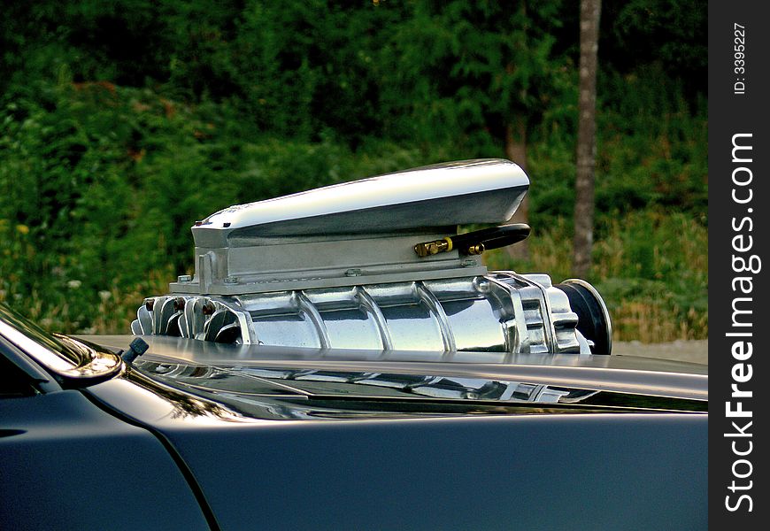 A shot of a blower on a black car. A shot of a blower on a black car.