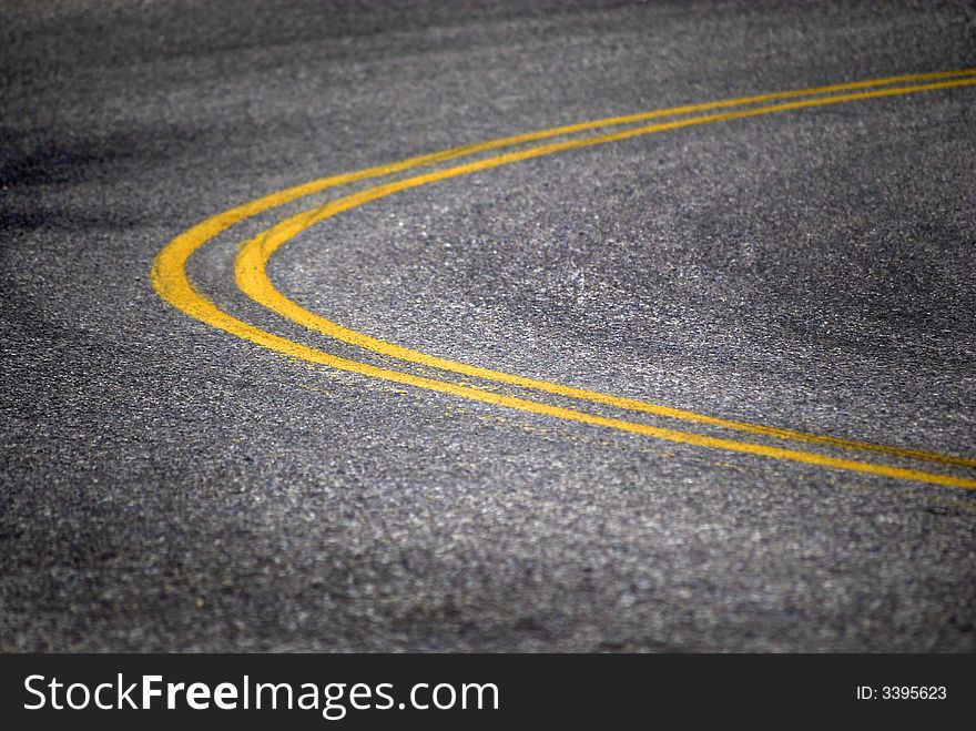 Isolated roadway with painted double yellow lines