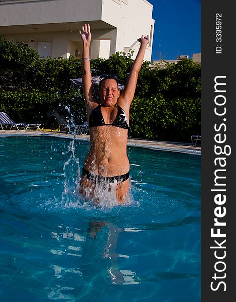 Jumping girl in swimminpool