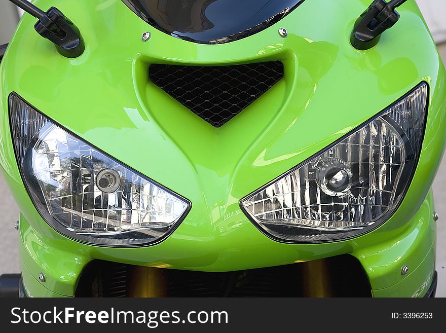 Close up view of the green motor headlights. Close up view of the green motor headlights.