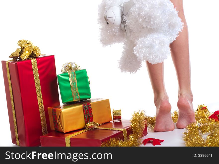 A little legs and xmas presents on white background