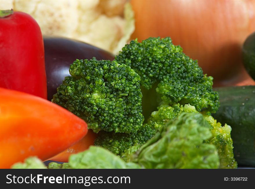 An image of broccoli amongst vegetables