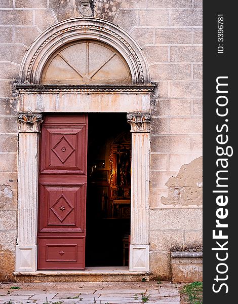 Old church door in a mediterranean city