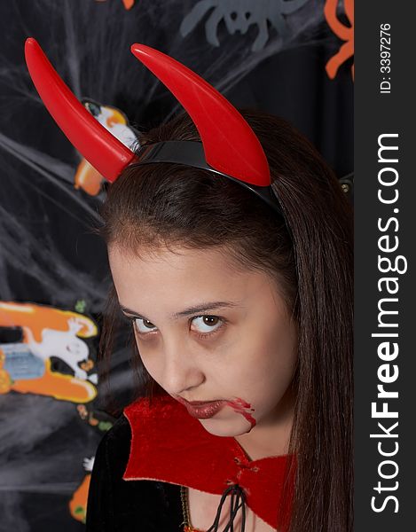 A young female dressed in a halloween costume