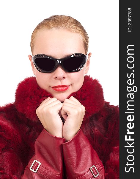 Woman in a fur coat and sunglasses. Woman in a fur coat and sunglasses